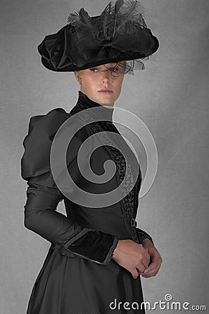 Late Victorian woman in green silk ensemble Stock Photo