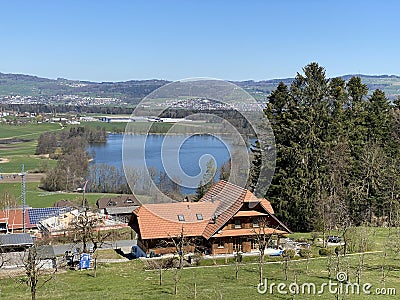 Late winter and early spring on the lake Mauensee or Lake Mauen Mauesee - Canton of Lucerne, Switzerland Schweiz Editorial Stock Photo