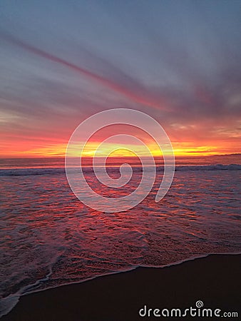 Late yellow pink red purple sunset over the beach 4k Stock Photo