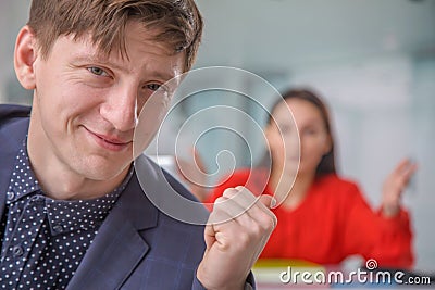 Latent aggression and conflict between male worker and his angry female business boss Stock Photo