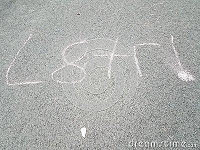 later written in shorthand in chalk on asphalt Stock Photo