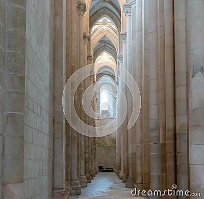 The lateral aisle of the nave of the church of the Alcobaca monastery Editorial Stock Photo