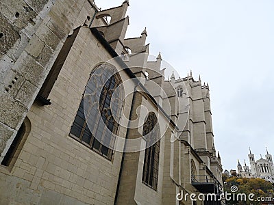 Lateral facade view of the Cathedral of St. John the Baptist of Lyon and the Basilic of Notre Dame at the background, France Stock Photo