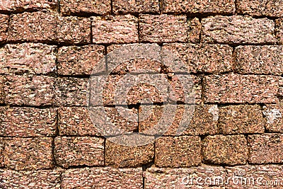 A laterite wall made of blocks Stock Photo