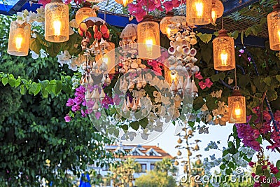 Latern with light under bougainville flowers in Datca, Turkey Stock Photo