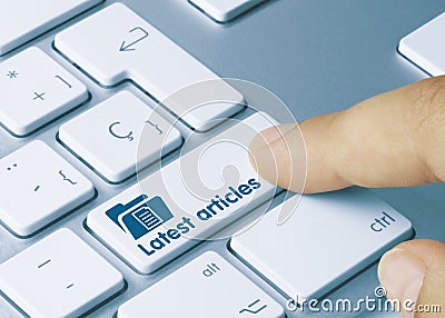 Latest articles - Inscription on Blue Keyboard Key Stock Photo