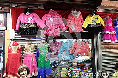 Latest Indian Childrens clothing in front of a retail cloth shop in Kolkata Editorial Stock Photo