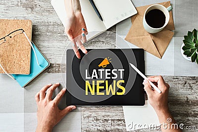 Latest news text and icon on device screen. Business internet and technology concept. Stock Photo