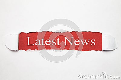 Latest News text on torn paper. Business concept Stock Photo