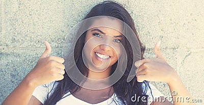 Latin american woman showing both thumbs up in vintage retro loo Stock Photo