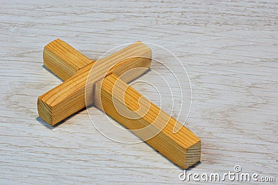 Latin cross on wooden background. Cross religious attribute of a geometric figure. In many beliefs carries sacral meaning - is Stock Photo