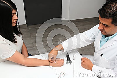 Latin doctor specialist neurologist performs a study of evoked potentials, diagnostic techniques with sensory stimuli and the reco Stock Photo