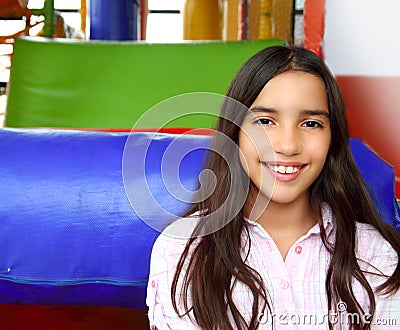 Latin indian teen girl smiling in playground Stock Photo