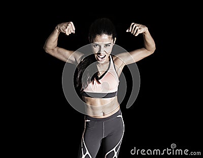 Latin sport woman posing in fierce and badass face expression w Stock Photo