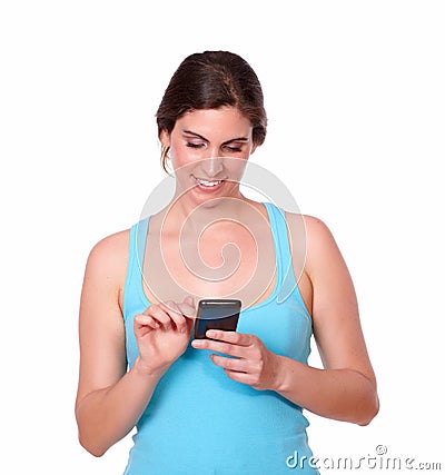 Latin sporty woman texting on cellphone Stock Photo