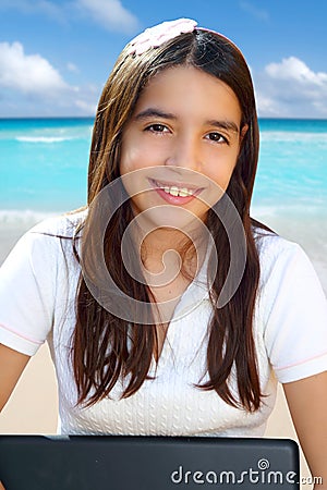 Latin teenager student smiling holding laptop Stock Photo