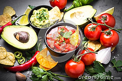 Latinamerican food party sauce guacamole, salsa, chips and ingre Stock Photo