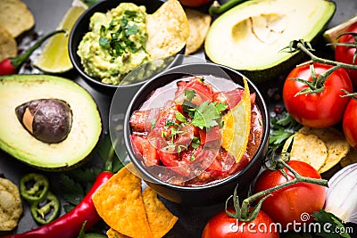 Latinamerican food party sauce guacamole, salsa, chips and ingre Stock Photo