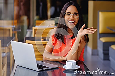 Latinamerican girl have a coffee break in a cafe Stock Photo