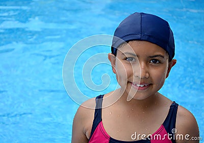 Latinamerican girl in the swimming pool. Stock Photo