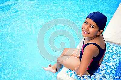 Latinamerican girl in the swimming pool. Stock Photo