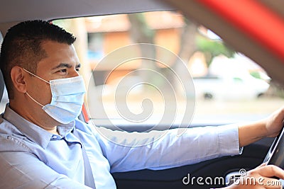Latino adult driver works with security measures and contingency protection covid-19 Stock Photo