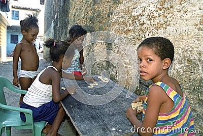 Latino children play Domino in slum, Recife, Brazil Editorial Stock Photo