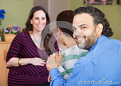 Latino Couple with Surrogate Mother Stock Photo