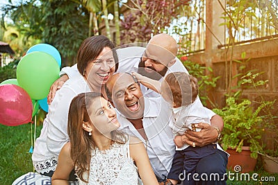 Latino family have fun on garden Stock Photo