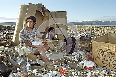 Latino mother and daughter work on garbage dump Editorial Stock Photo