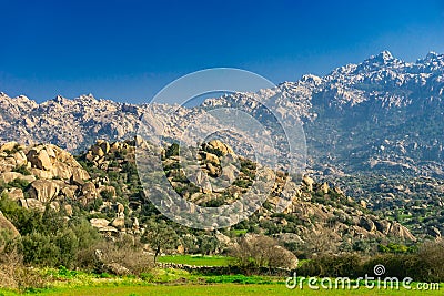 Latmos Besparmak Mountain and the village of KapÄ±kÄ±rÄ± among the ruins of Heracleia. Milas, Aydin, Turkey Stock Photo