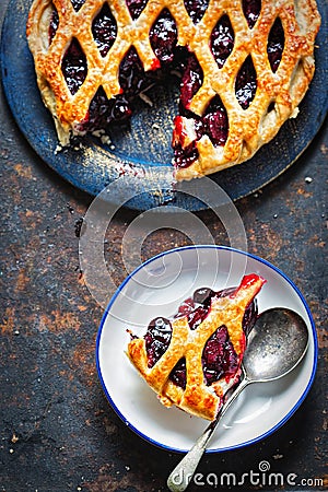 Lattice autumn fruit pie, with blackcurrant, blackberry, cherry compote in puff pastry pie Stock Photo