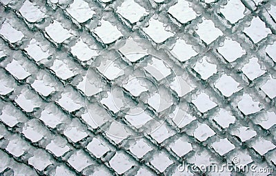 Lattice fence with ice Stock Photo