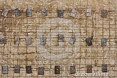 Lattice reinforced concrete wall with metal washers and bolts Stock Photo