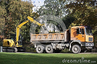 Latvia. Excavator loads trash Stock Photo