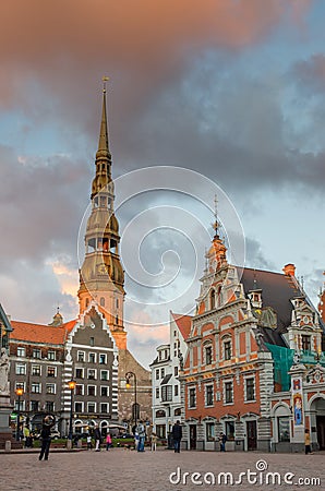 LATVIA RIGA AUG 2018 evening view of the saint peter tower and blackhead house in the Old Riga Editorial Stock Photo