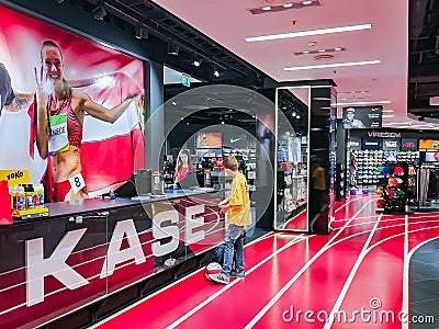 Teenager buying a basketball in a Sportland sporting goods retailer Editorial Stock Photo