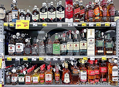 Large assortment of alcoholic beverages high quality of different manufacturers in shopping mall Editorial Stock Photo