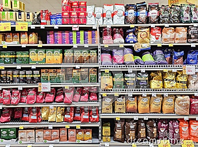 Large assortment of coffee beans from various manufacturers on Lidl supermarket shelves, Riga. Editorial Stock Photo