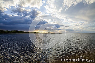 Latvia. Sunset on the river. Change in the weather. Elemental binge. Stock Photo