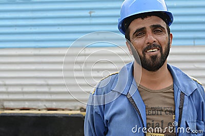 Laughing Afghanistanian construction workman at building site Editorial Stock Photo