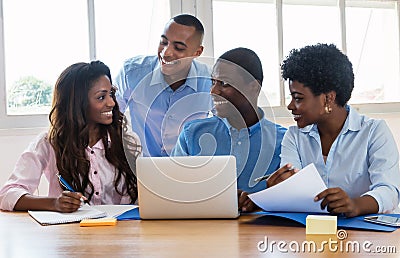 Laughing african american businessmen and businesswoman Stock Photo