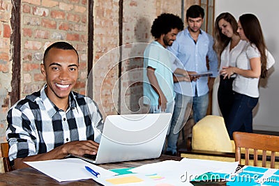 Laughing african american software developer at office of company Stock Photo