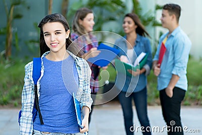Laughing american female student with group of young adults Stock Photo