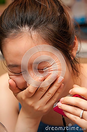 Laughing Asian woman Stock Photo