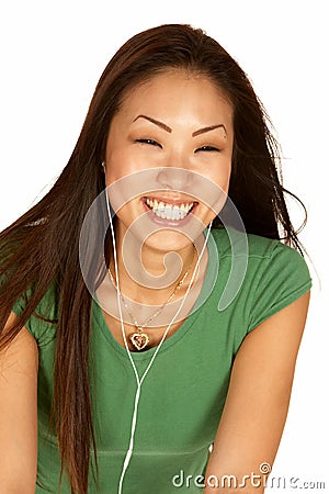 Laughing Asian Woman with Ear Buds Stock Photo