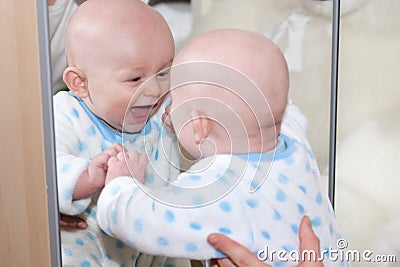 Laughing Baby Looking in Mirror Stock Photo