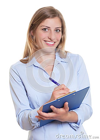 Laughing blonde businesswoman with clipboard Stock Photo
