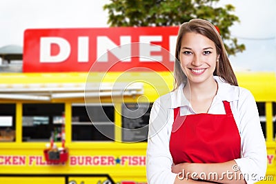 Laughing blonde waitress with food truck Stock Photo