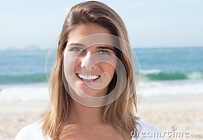 Laughing blonde woman at beach Stock Photo